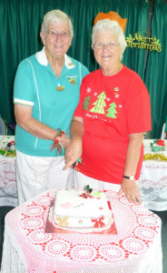 Dist.Pres.Pat, Umpires Discussion Group Leader Leanne cutting cake
