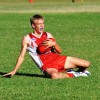 Young Coffs Swans player Jake Brown dives to take a safe chest mark. Photo: Matt McInerney/Daily Examiner