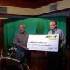 PNG Cricket Board deputy chairman Babani Maraga receiving the K80 000 cheque from SP Brewery general manager Stan Joyce