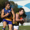 Travis Dean (right) playing for the Werribee Districts in 2014.